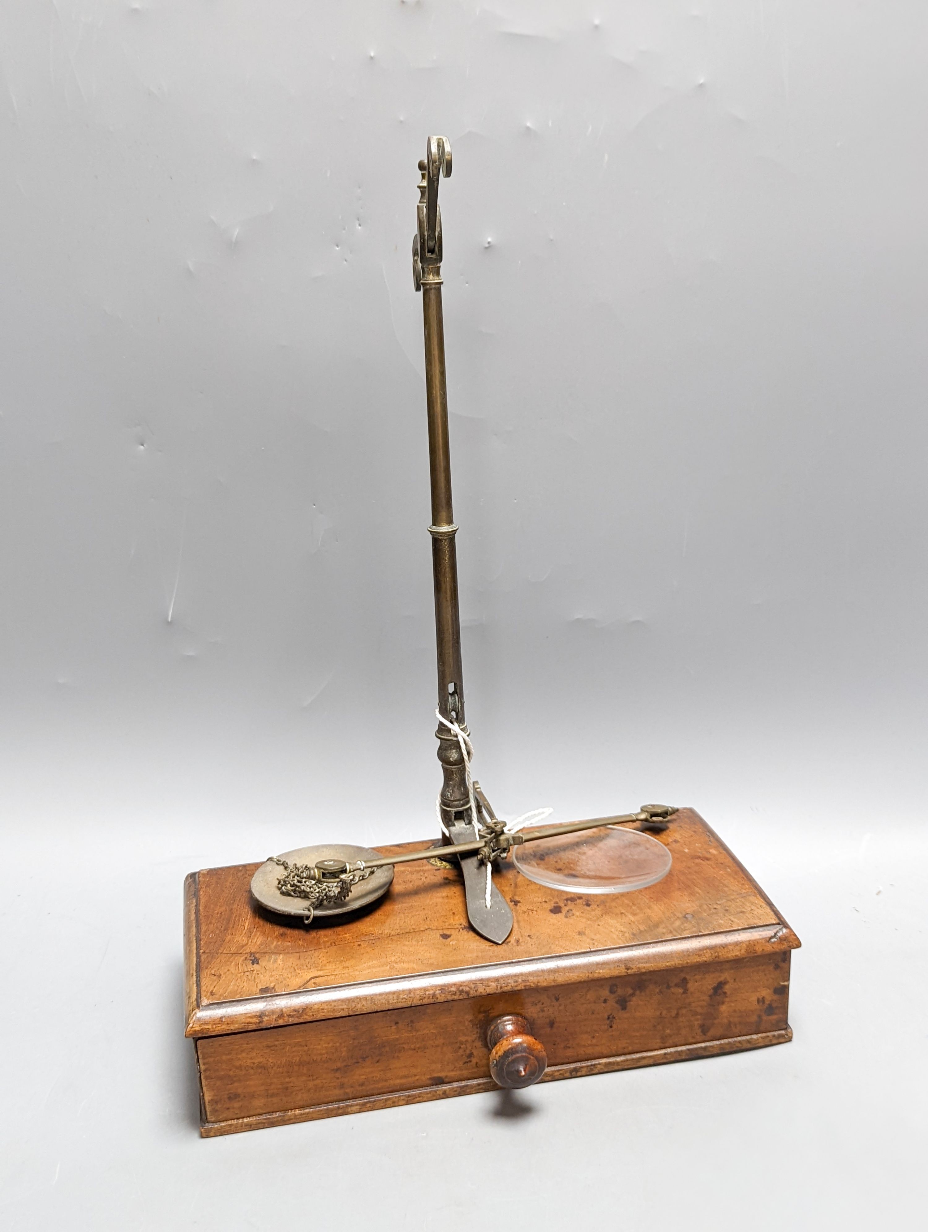 A Victorian cased weighing scale, two papier mache wine coasters and surveyor's measure.